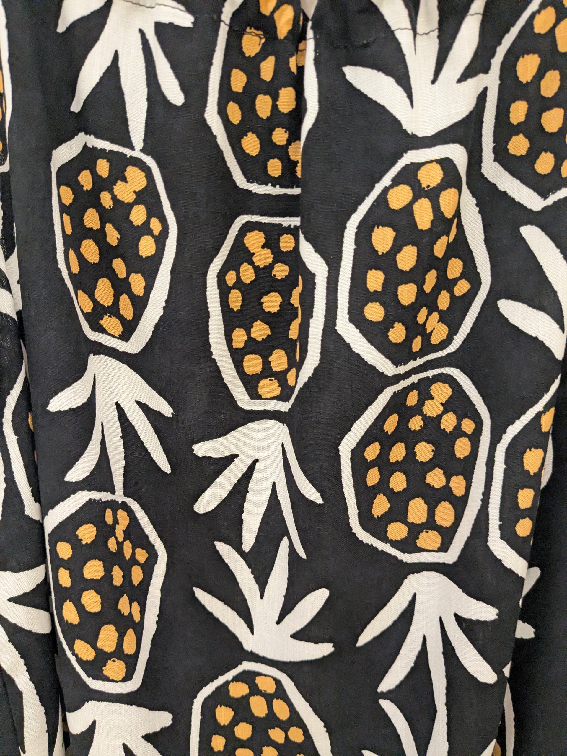 Top Piña negro y naranja